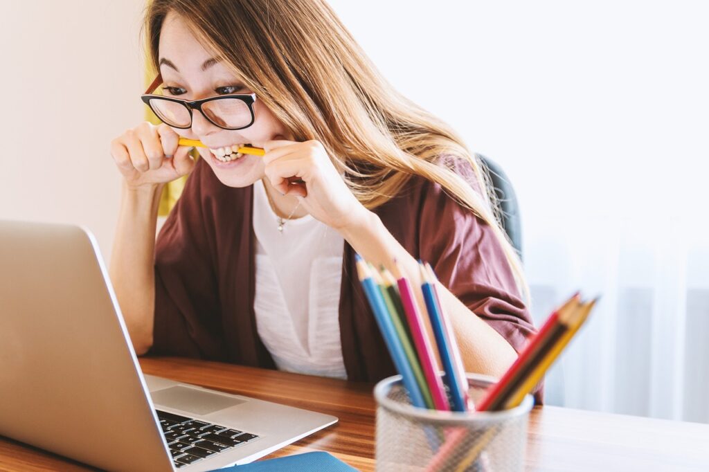 Woman Studying Over Laptop